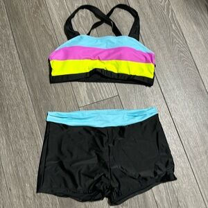 Women’s two piece swim suit.  Size Large but runs a little small.